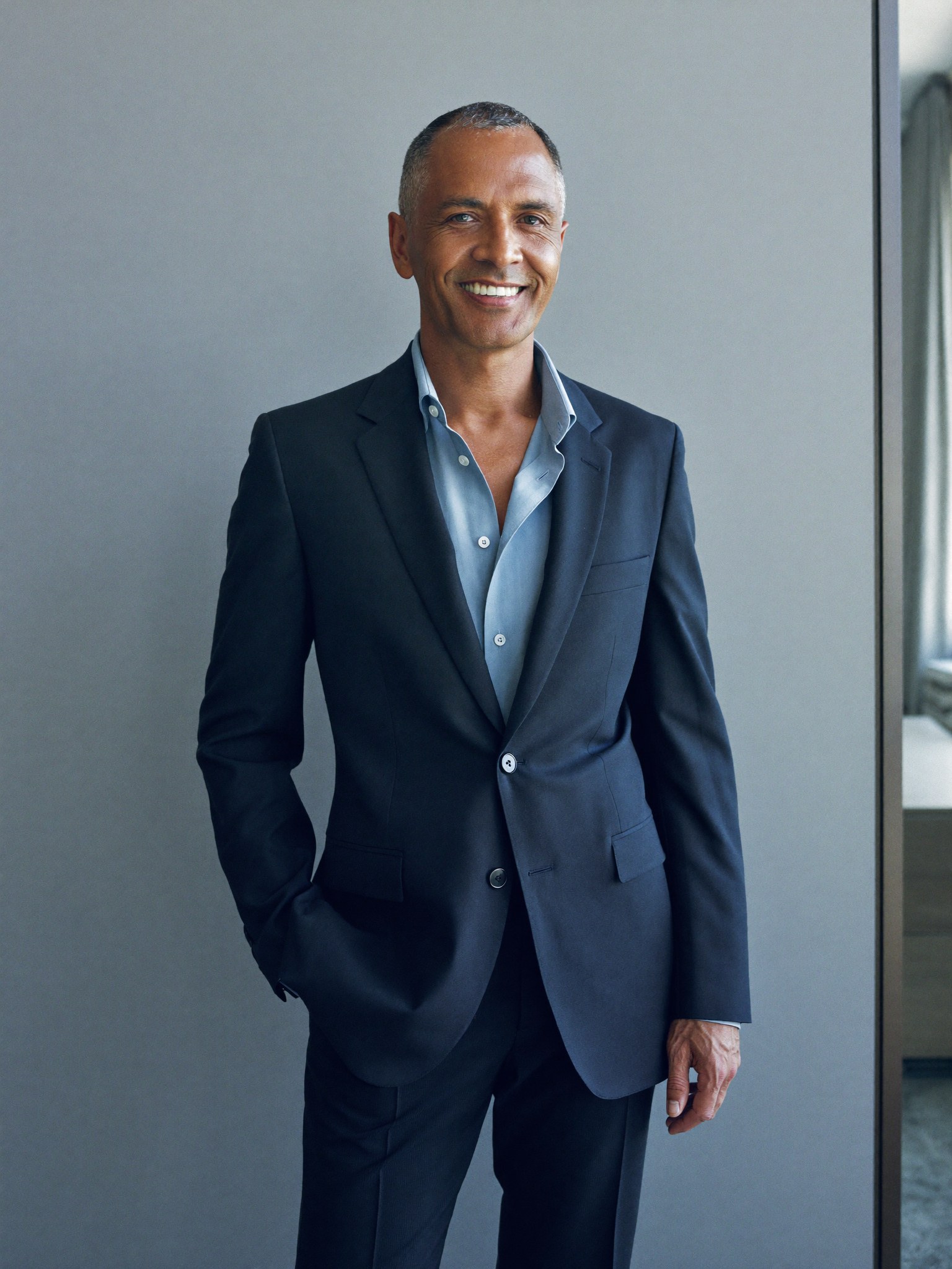 A quietly confident, distinguished professional man, rested and refreshed, fully dressed